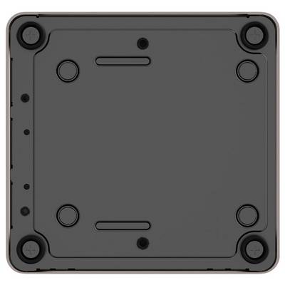 Unteransicht eines kleinen schwarzen quadratischen Geräts oder Gehäuses mit vier Gumminoppen in den Ecken und mehreren Schraubenlöchern und Lüftungsschlitzen.