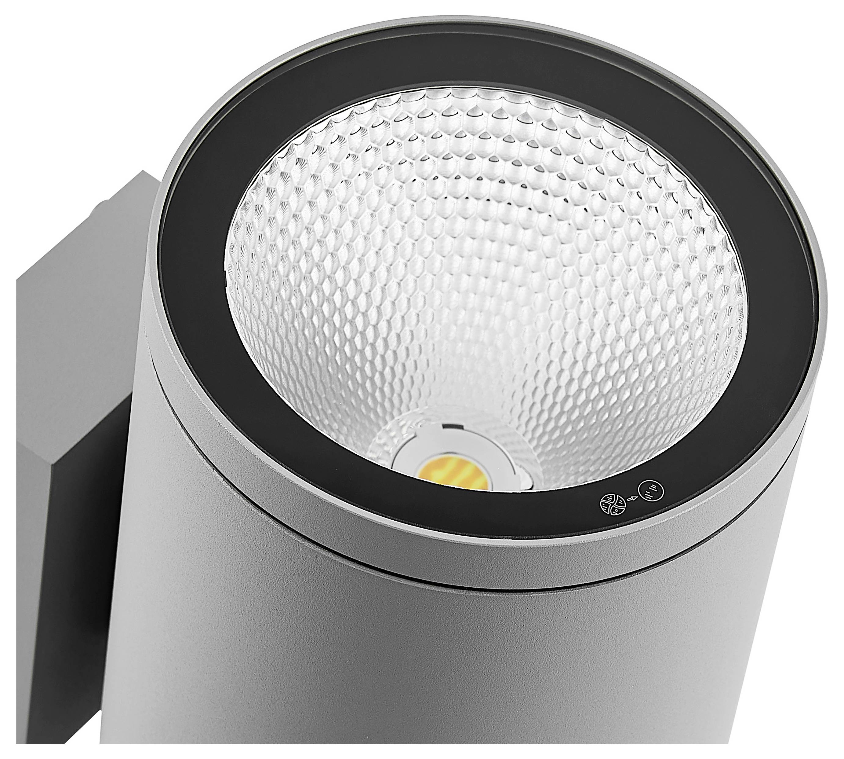 Nahaufnahme einer modernen zylindrischen Schienleuchte mit reflektierendem strukturiertem Inneren und sichtbarer LED-Lichtquelle.