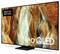 Samsung Neo QLED Flachbildfernseher mit abstrakter Gold-, Braun- und Blaugrün-Kunstwerk-Anzeige, mit „Made for Germany"-Etikett und „Neo QLED"-Text.