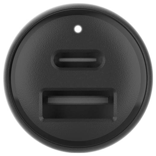Nahaufnahme eines schwarzen, kreisförmigen USB-C-Ladegeräts oder Stromadapters mit einem kleinen Statuslicht und zwei Anschlussöffnungen.