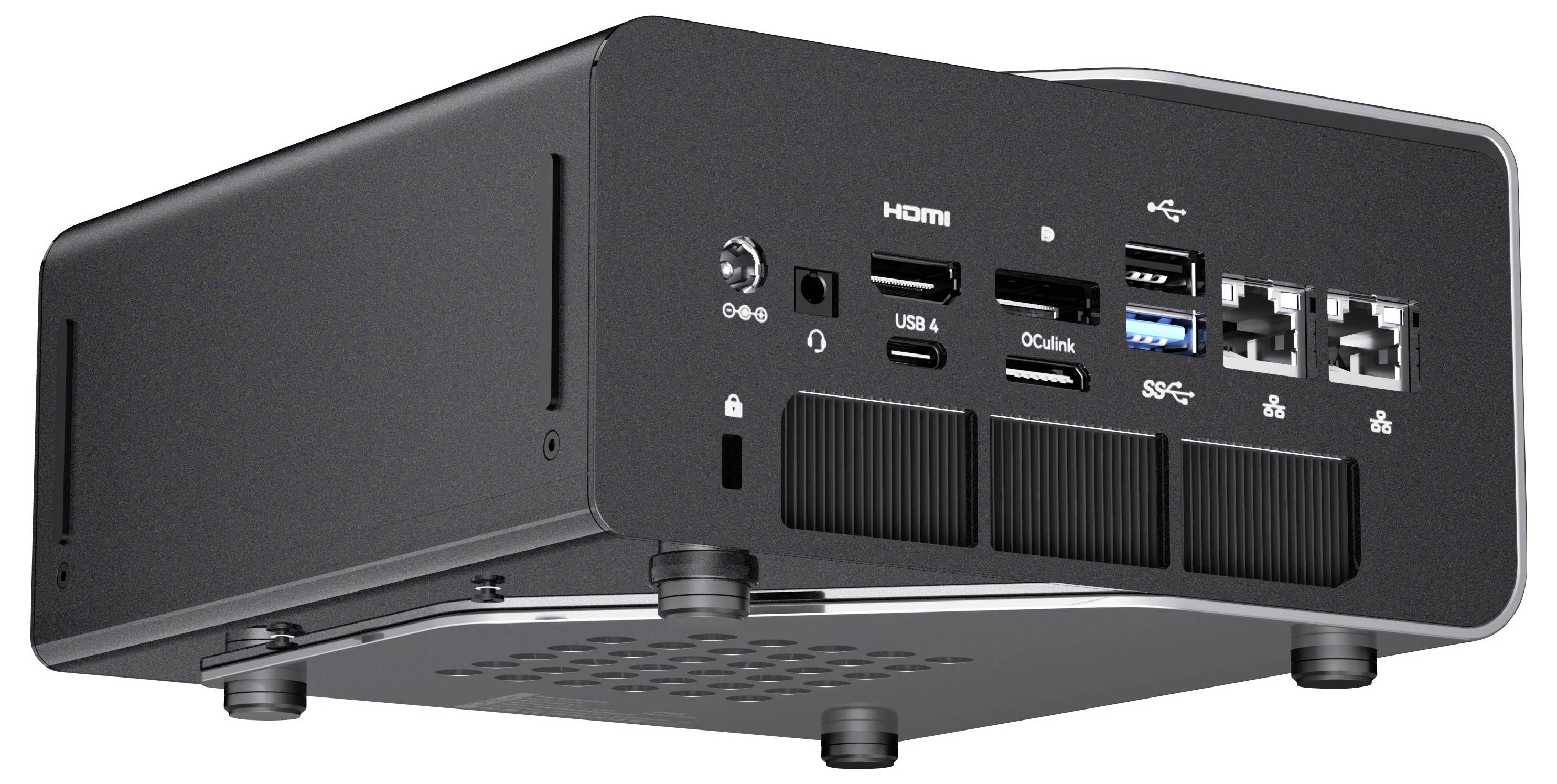 Schwarzes kompaktes elektronisches Gerät von unten gezeigt, mit HDMI-, USB-, Audio- und anderen Anschlüssen auf der Rückseite.