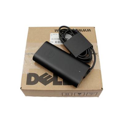 Dell-Laptop-Netzteil mit aufgewickeltem Kabel, das auf einer Dell-Pappschachtel ruht