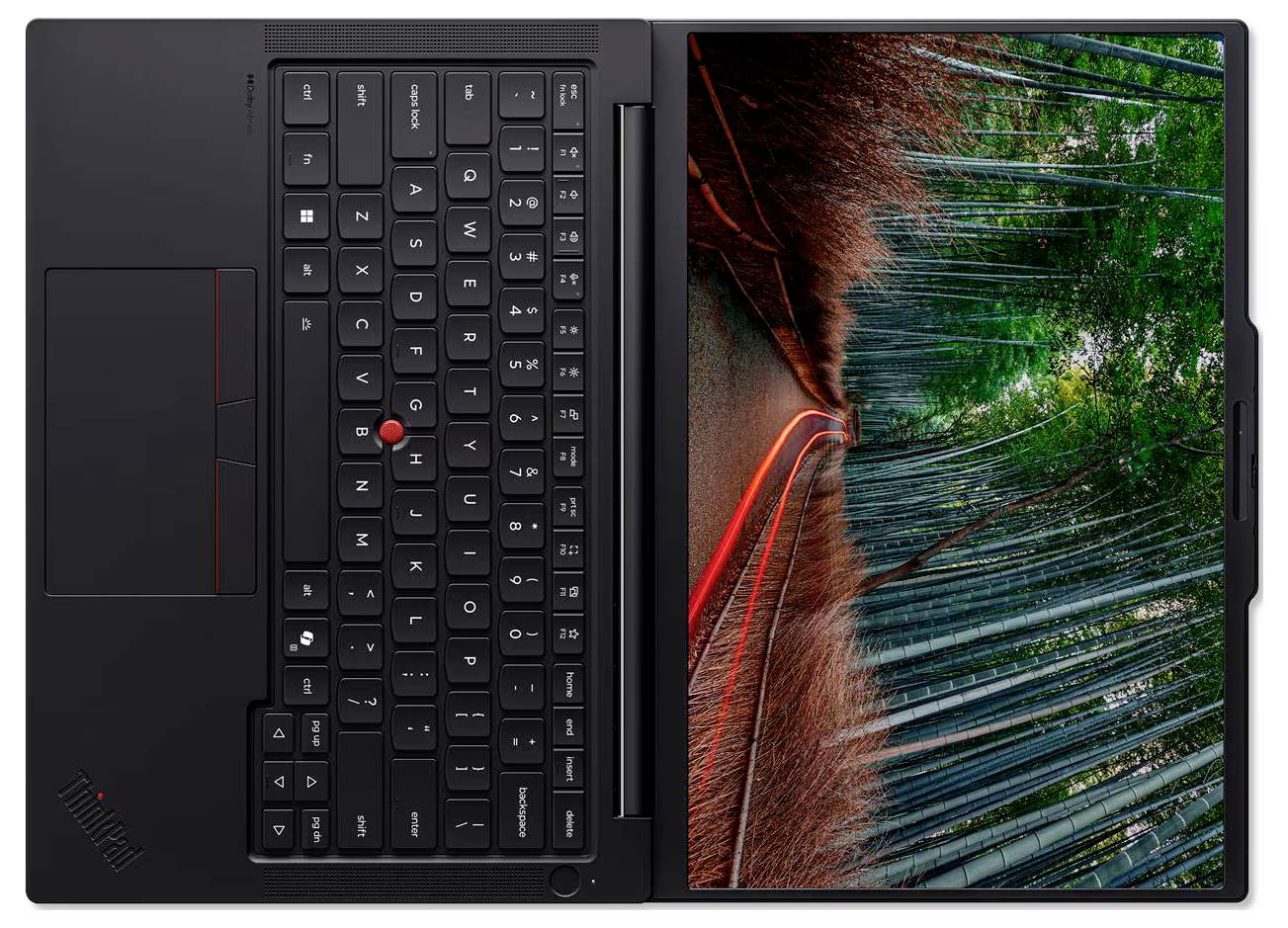 Draufsicht auf einen schwarzen Lenovo ThinkPad Laptop, geschlossen mit sichtbarer Tastatur auf der linken Seite und Bildschirm, der auf der rechten Seite ein farbenfro‌hes abstraktes rot-grünes Muster zeigt.