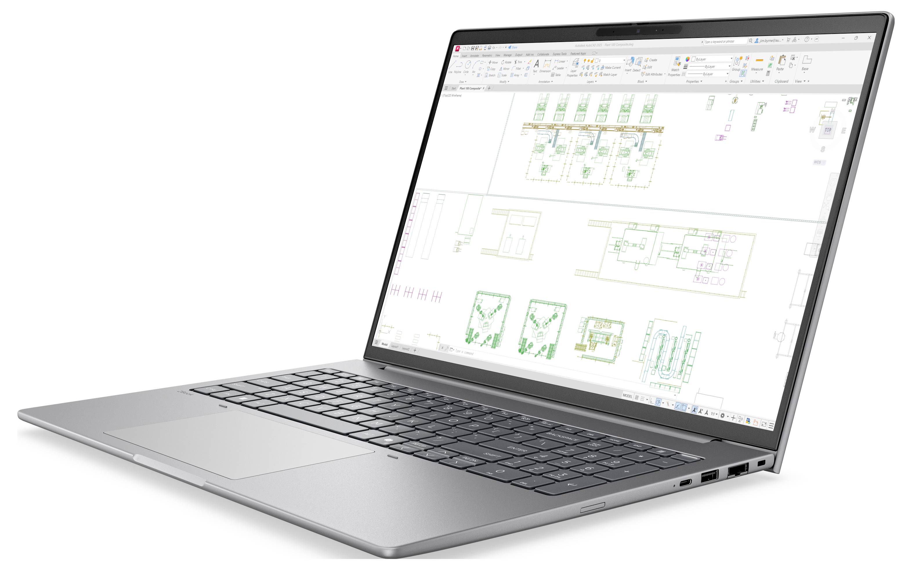 Silberner Laptop, auf dessen Bildschirm architektonische Grundrisse und Diagramme angezeigt werden