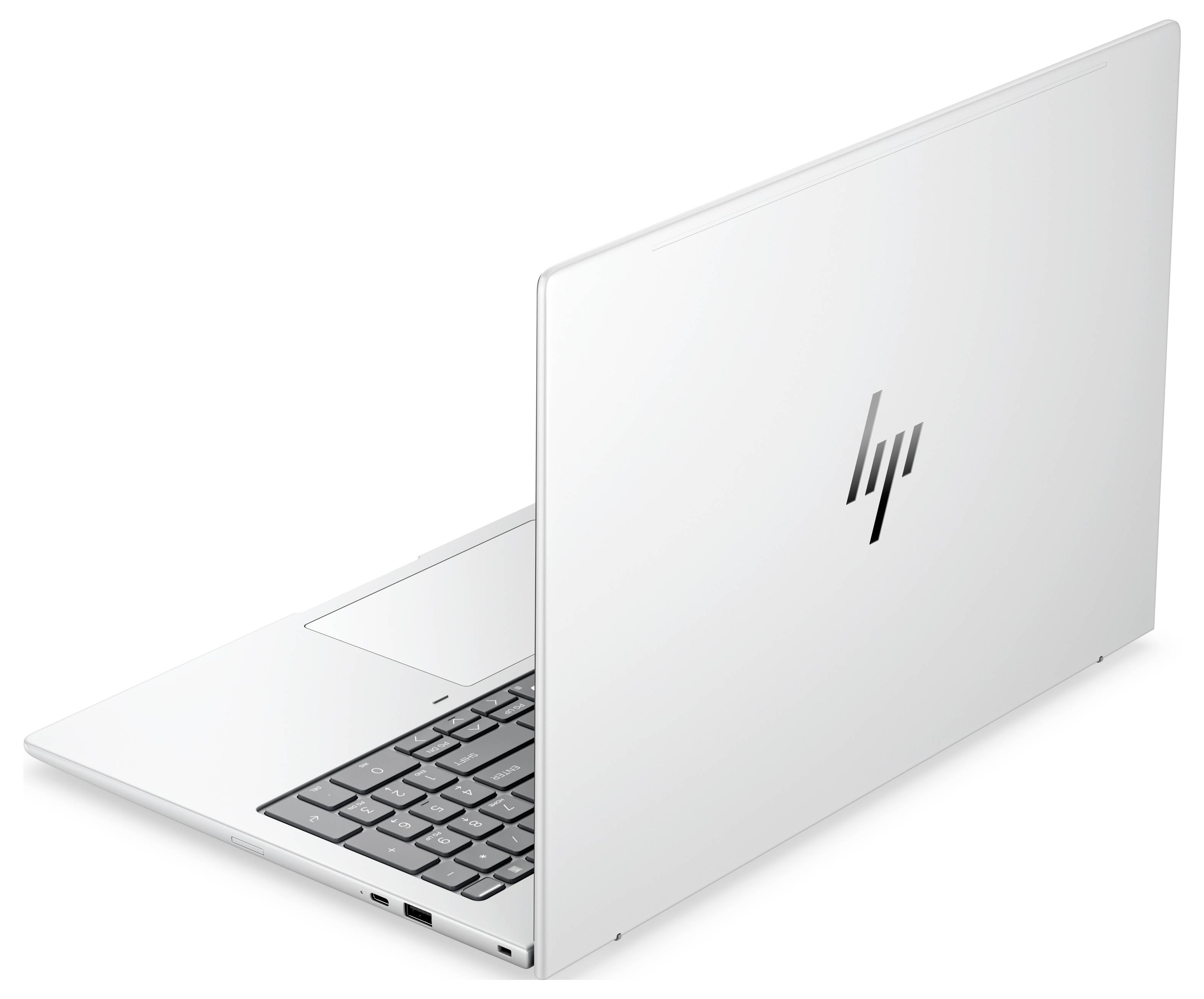 Silberner Laptop in einem Winkel geöffnet, auf dessen Bildschirm das blaue abstrakte Hintergrundbild von Windows 11 angezeigt wird.