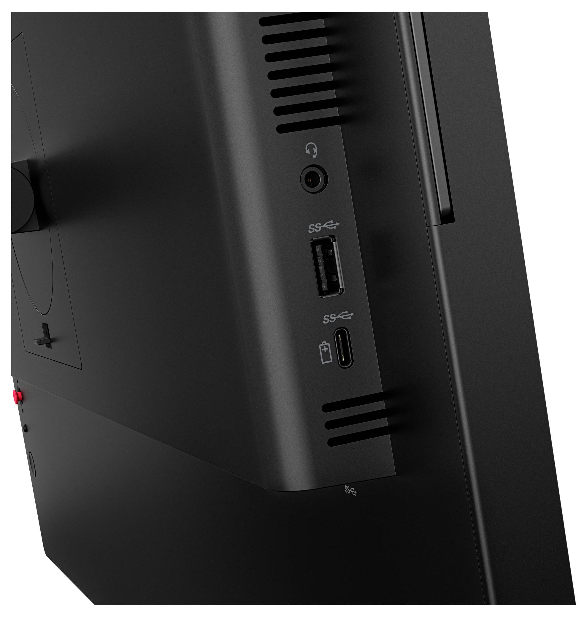 Nahaufnahme eines schwarzen Monitor- oder Computer-Tower-Seitenpanels mit Belüftungsschlitzen, einer Kopfhörerbuchse, einem USB-A-Anschluss und einem USB-C-Anschluss.