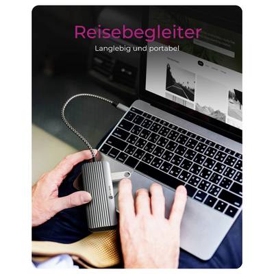 Desktop-Dual-Schacht-Festplattendockingstation mit deutschem Text „Duales Einschubdesign" und „unterstützt 2,5" und 3,5" Laufwerke", auf einem Schreibtisch mit einem eingesetzten Laufwerk gezeigt.