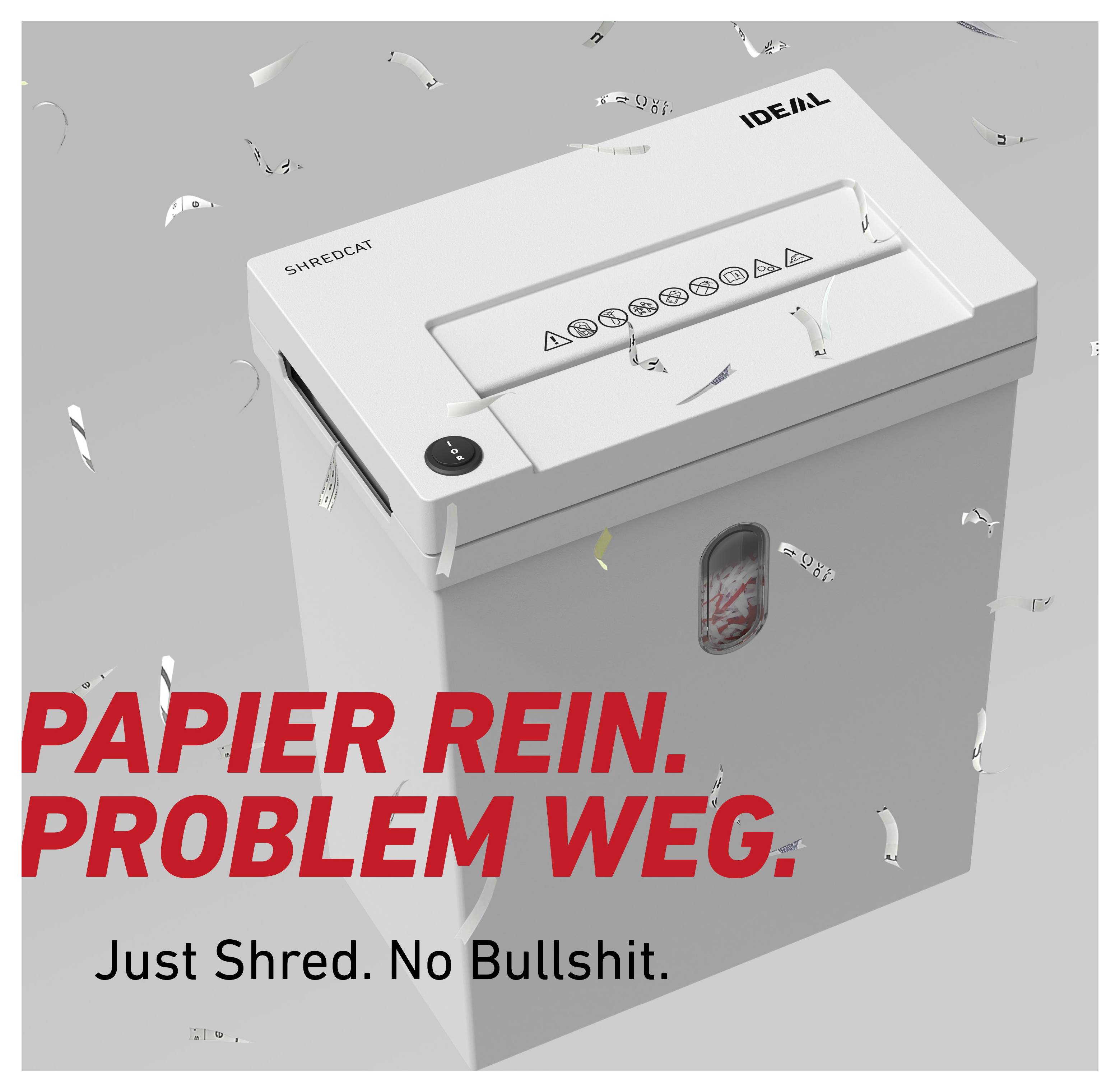 Werbeplakat für einen Aktenvernichter von IDEAL; weißes Gerät mit Konfetti, Text: 'PAPIER REIN. PROBLEM WEG.' und 'Just Shred. No Bullshit.'<br>