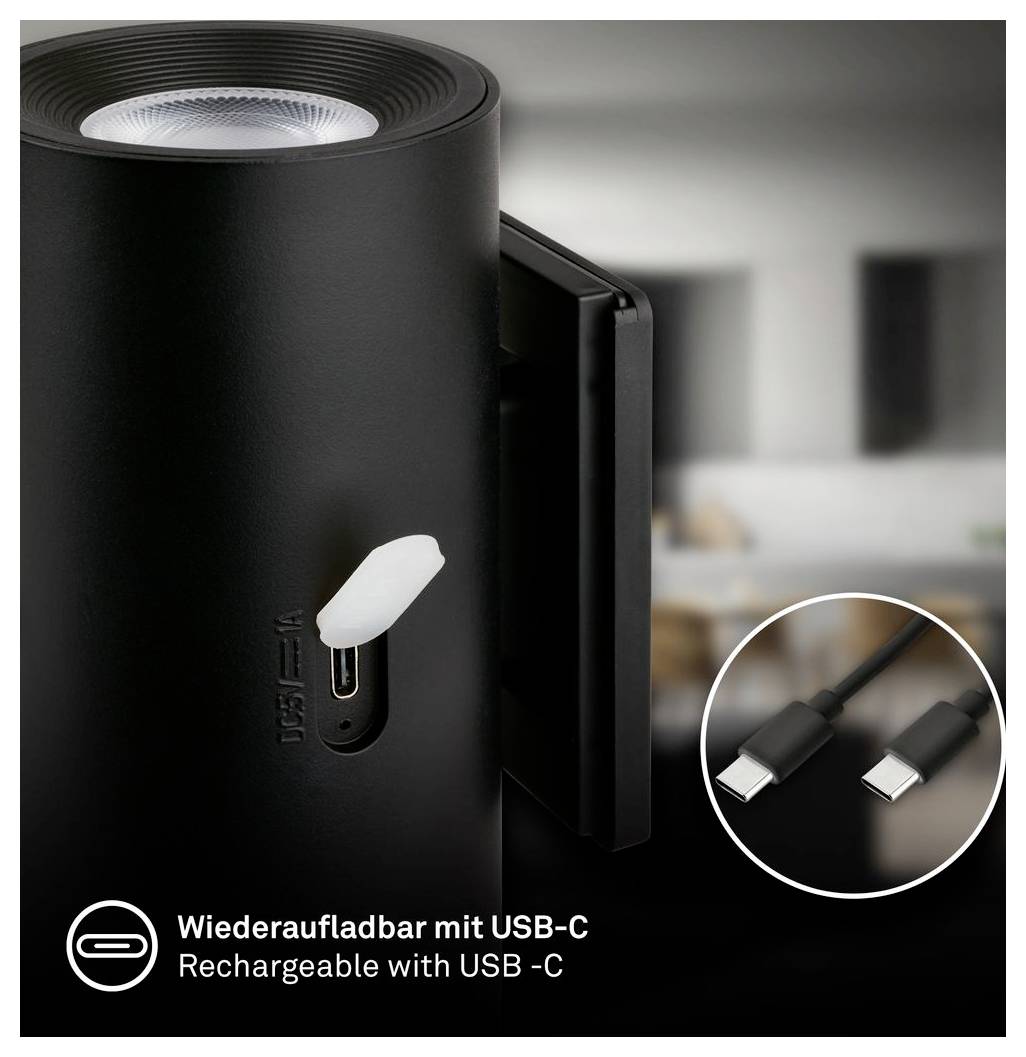Tragbarer schwarzer Lautsprecher oder Lampe mit USB-C-Ladeanschluss und enthaltenem USB-C-Kabel; Text besagt „Wiederaufladbar mit USB-C" und „Rechargeable with USB-C".