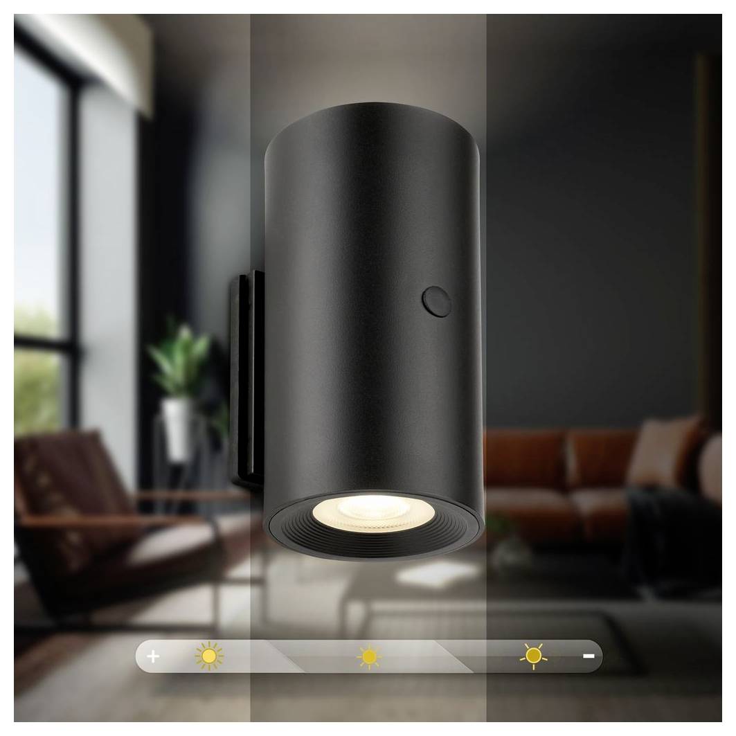 Ein schwarzes zylindrisches Deckenleuchten-Fixture in einem modernen Wohnzimmer, dargestellt mit einer Dimmer-Kontrollleiste und Helligkeitssymbolen am unteren Rand.