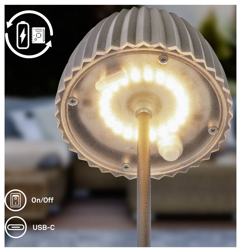 Nahaufnahme einer aufladbaren LED-Tischleuchte, die warm leuchtet, mit Ein-/Ausschalter und USB-C-Ladefunktion im Bild dargestellt.