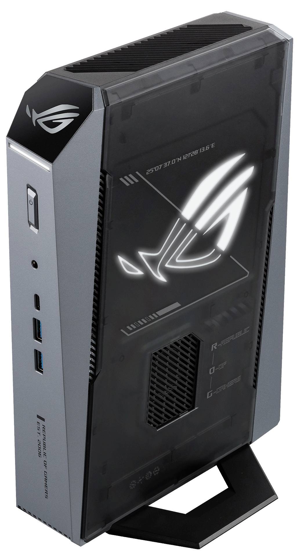 ASUS ROG Gaming Mini-PC Tower in Schwarz und Grau, aufrecht auf einem Ausstellungsständer positioniert mit beleuchtetem Republic of Gamers Logo auf der Vorderseite.