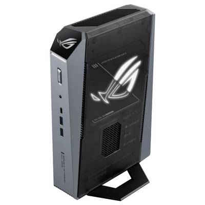 ASUS ROG Gaming Mini-PC Tower in Schwarz und Grau, aufrecht auf einem Ausstellungsständer positioniert mit beleuchtetem Republic of Gamers Logo auf der Vorderseite.