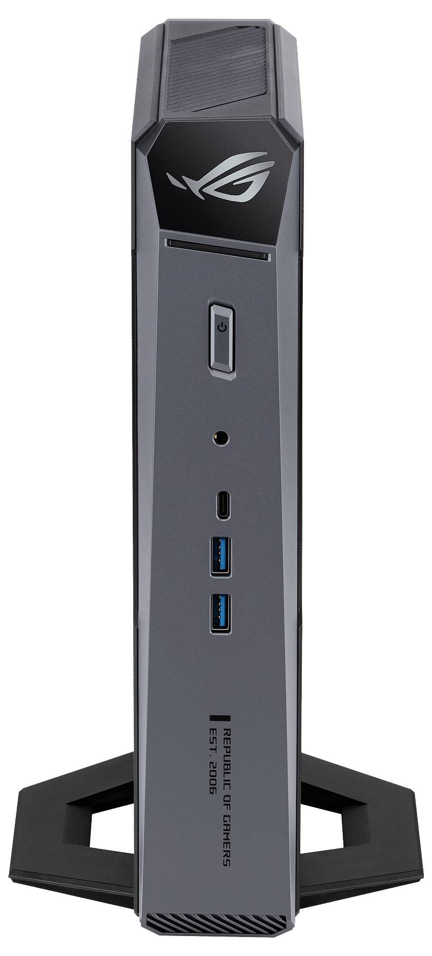 Vorderansicht eines schlanken ASUS ROG Mini-PC-Towers auf einem Ständer, der das ROG-Logo, den Ein-/Ausschalter und die USB-Anschlüsse an der Vorderseite zeigt.