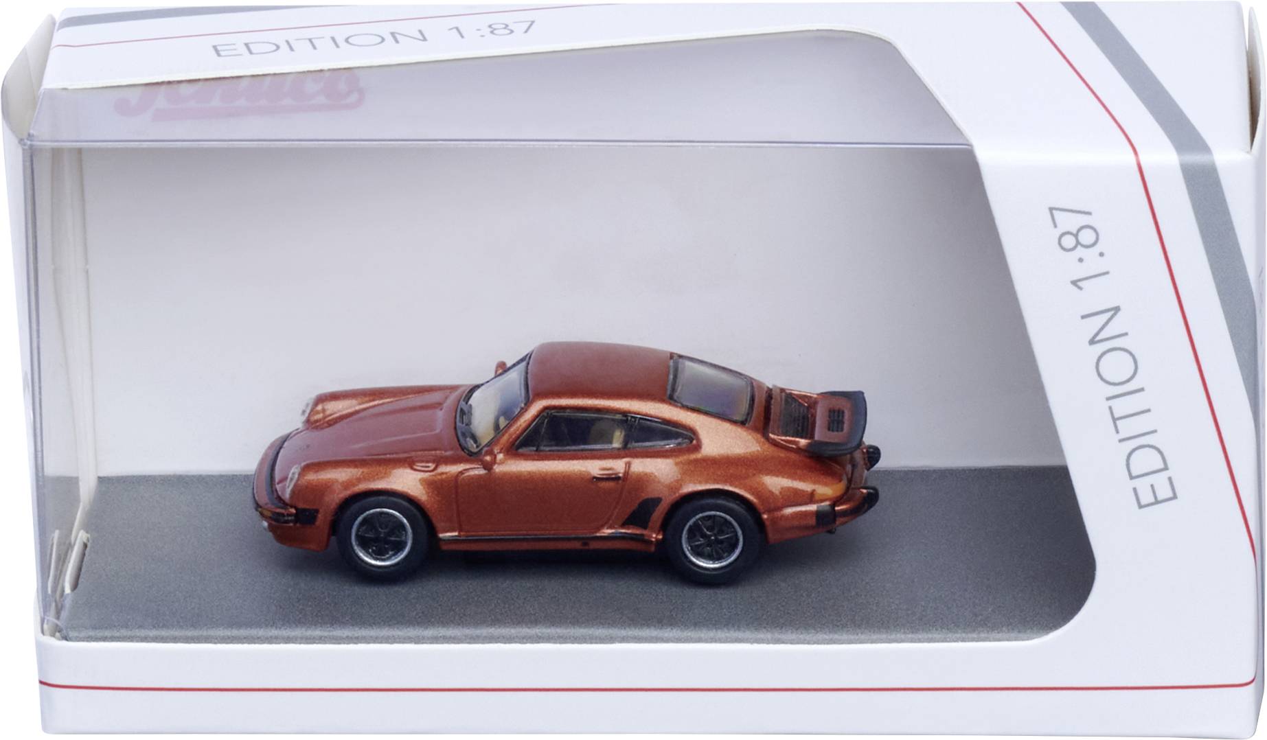 Orangefarbenes Druckgussmodell eines Sportwagens in einer klaren Vitrine mit der Aufschrift "Edition 1:87".