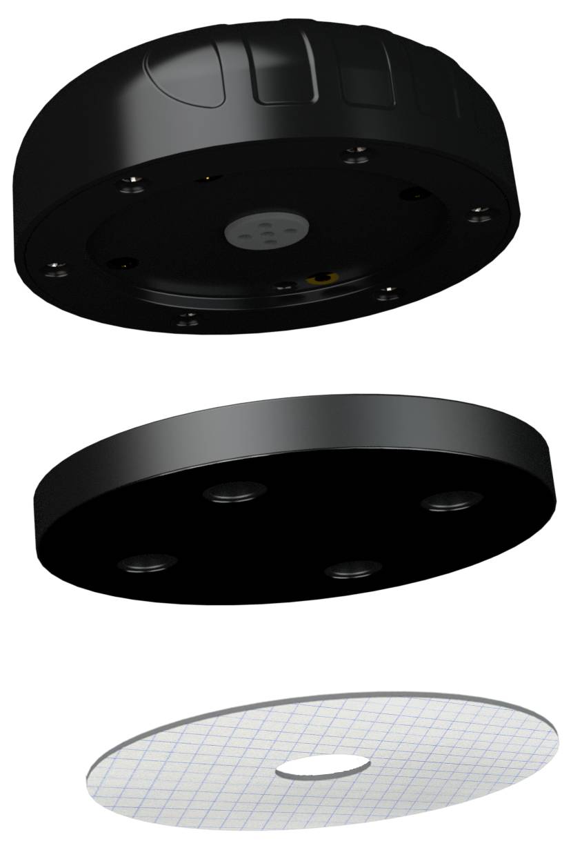 Explosionszeichnung eines schwarzen kreisförmigen Geräts mit einer Grundplatte und einer gemusterten Klebeschicht, die in drei Teile zerlegt ist.