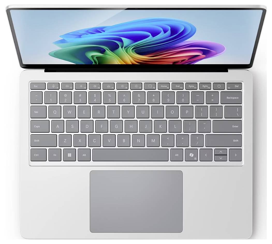 Von oben gezeigter Laptop mit geöffnetem Bildschirm, grauer Tastatur und großem Touchpad; auf dem Display ist ein buntes abstraktes Windows-Hintergrundbild zu sehen.