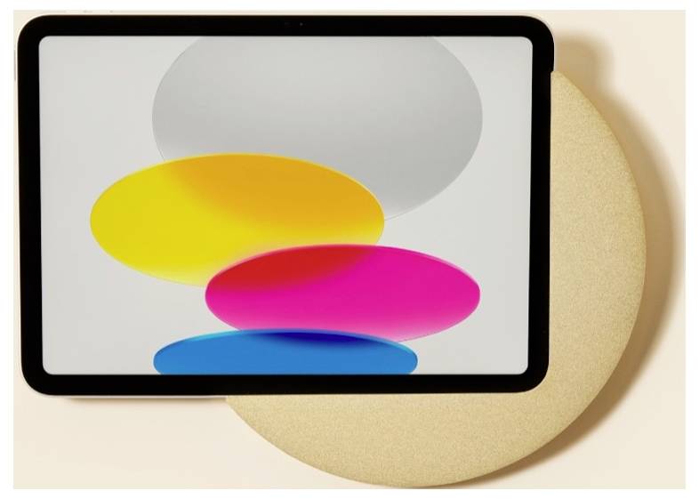Ein Tablet-Bildschirm zeigt drei überlagernde, farbenfrohe Ovale – gelb, rosa und blau – auf hellem Hintergrund, mit einem großen beigefarbenen Kreis dahinter.
