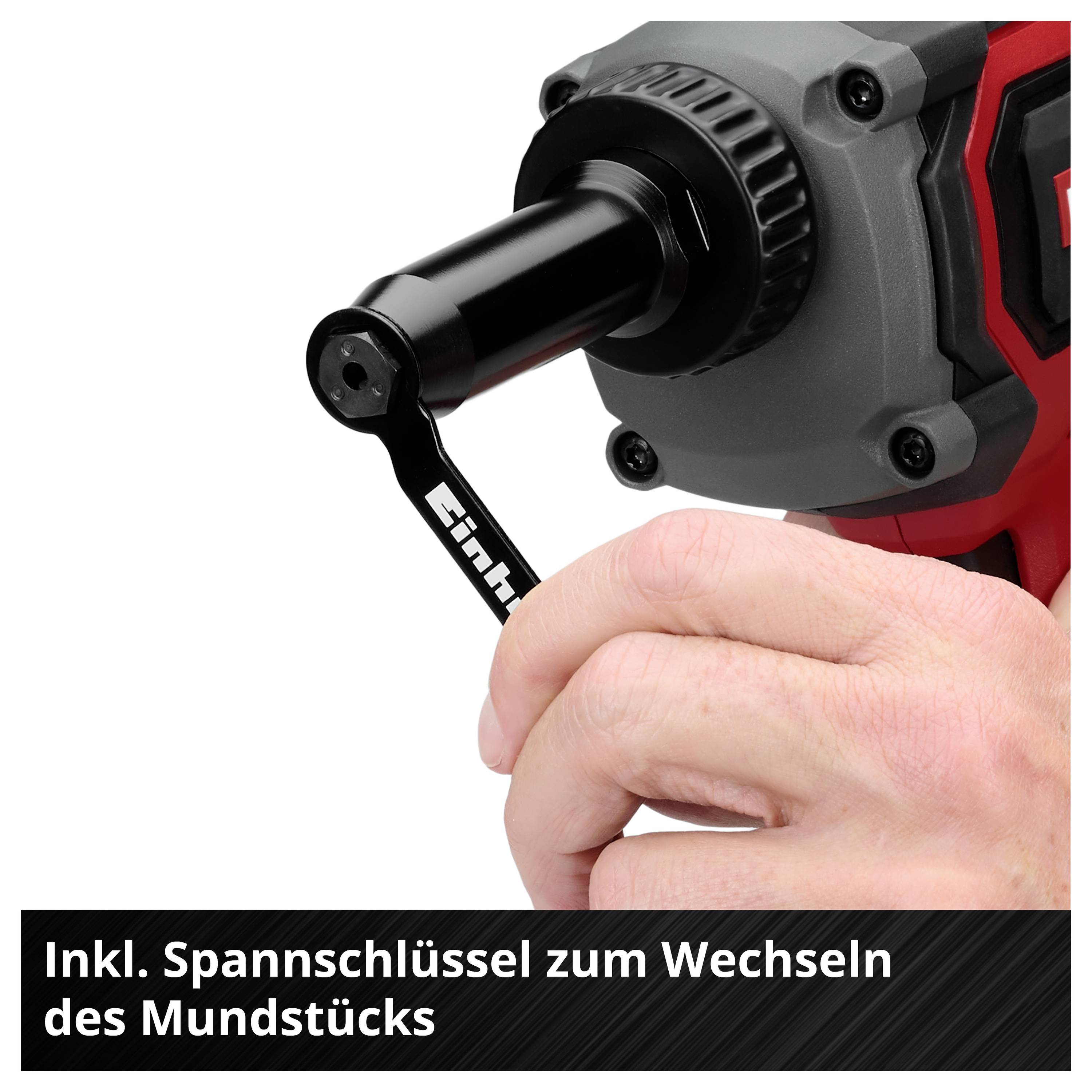 Nahaufnahme einer Bohrmaschine mit eingesetztem Spannschlüssel; Text: 'Inkl. Spannschlüssel zum Wechseln des Mundstücks'.