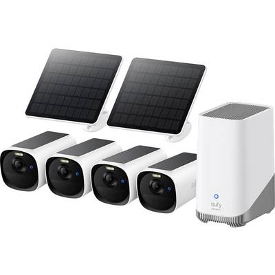 Drahtloses Sicherheitskamerasystem mit zwei Solarpanelen, vier Außenkameras und einer Basisstation auf weißem Hintergrund.