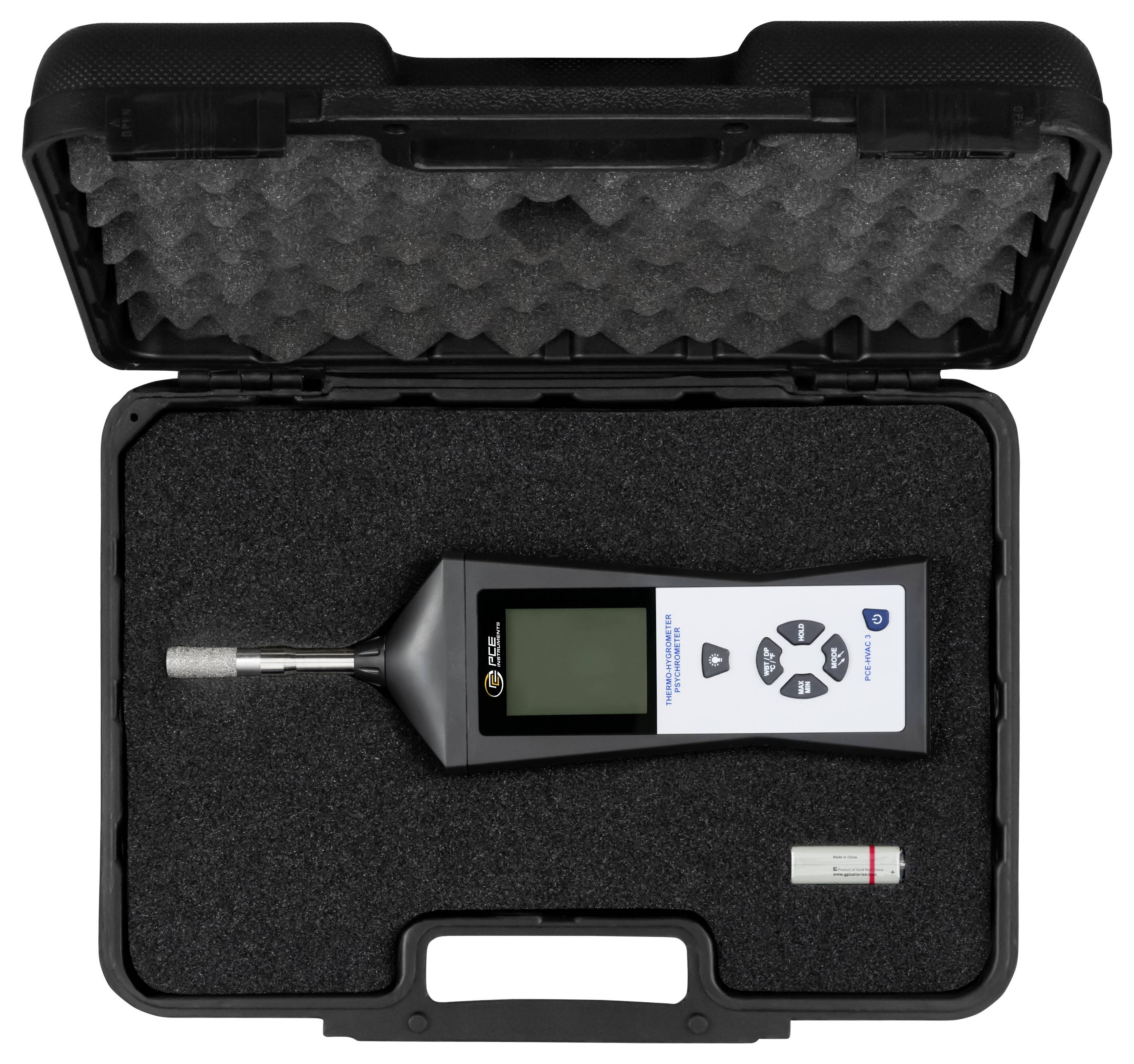 Offener Hartschalenkoffer mit einem tragbaren Messinstrument mit Display und Tasten sowie einem kleinen Zubehörteil in Schaumstoffpolsterung.