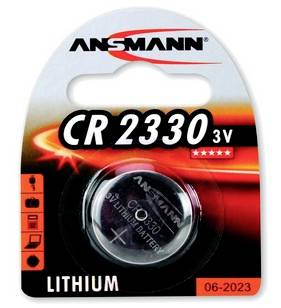 Verpackung einer Ansmann CR 2330 3V Lithium-Knopfzelle in Blisterverpackung, mit der Aufschrift "LITHIUM" und dem Verfallsdatum "06-2023".