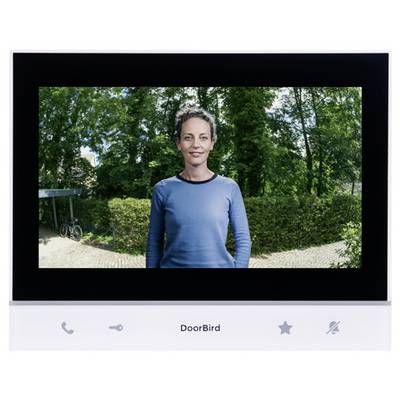 Videosprechanlage zeigt eine Frau, die im Freien steht, mit "DoorBird" darunter beschriftet und Anrufen-, Schlüssel-, Stern- und Stummschaltsymbolen auf dem Bedienfeld.