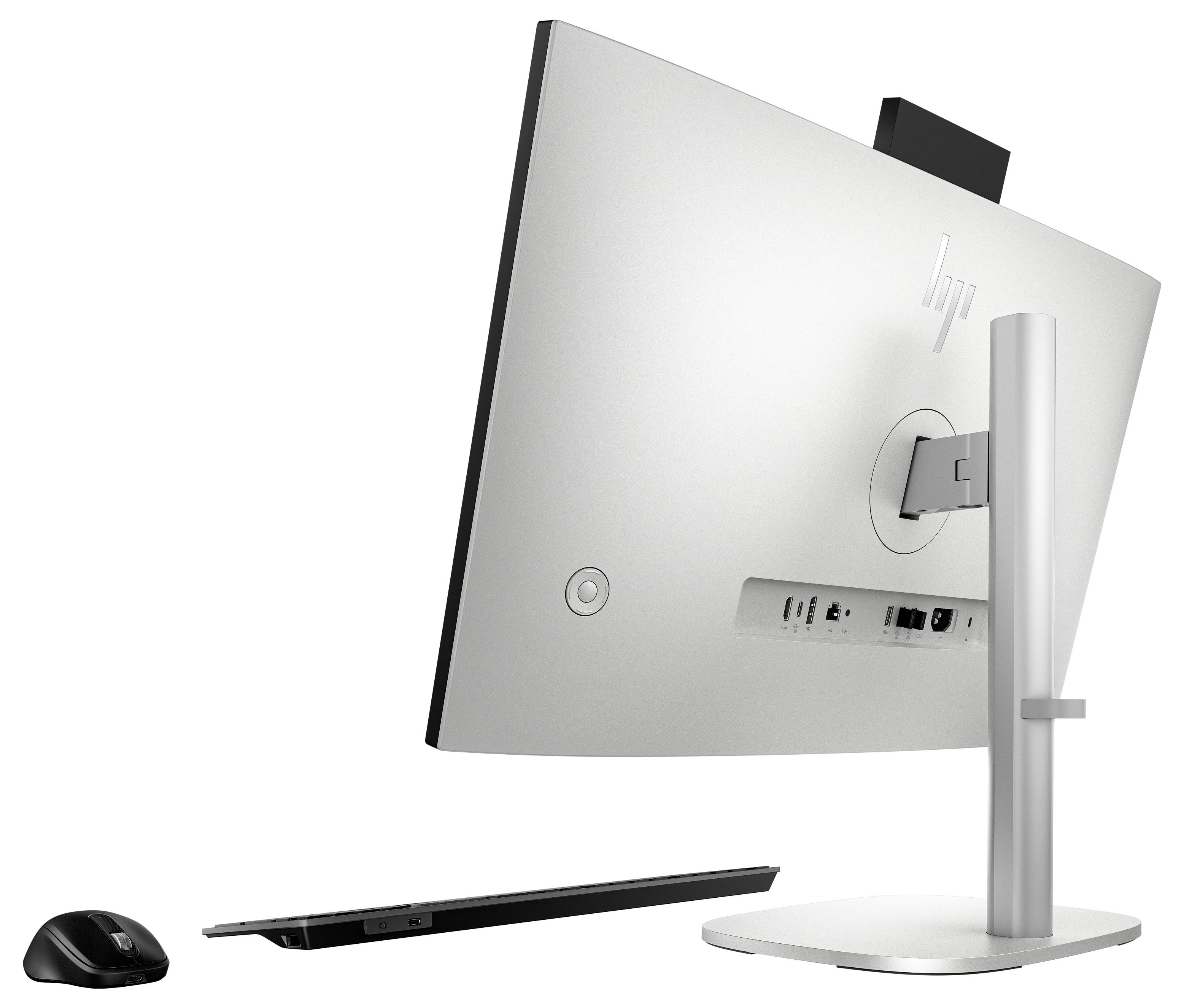 Silbergrauer HP-Desktopmonitor mit Ständer, von hinten dargestellt, neben einer kabellosen Maus und einer schlanken Tastatur.