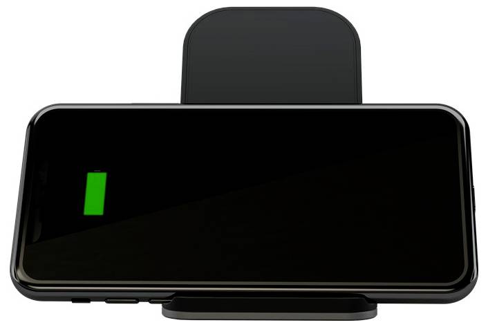 Ein Smartphone in einer Landschafts-Wireless-Ladestation mit einem grünen Batteriesymbol auf dem Bildschirm, das anzeigt, dass es geladen wird.