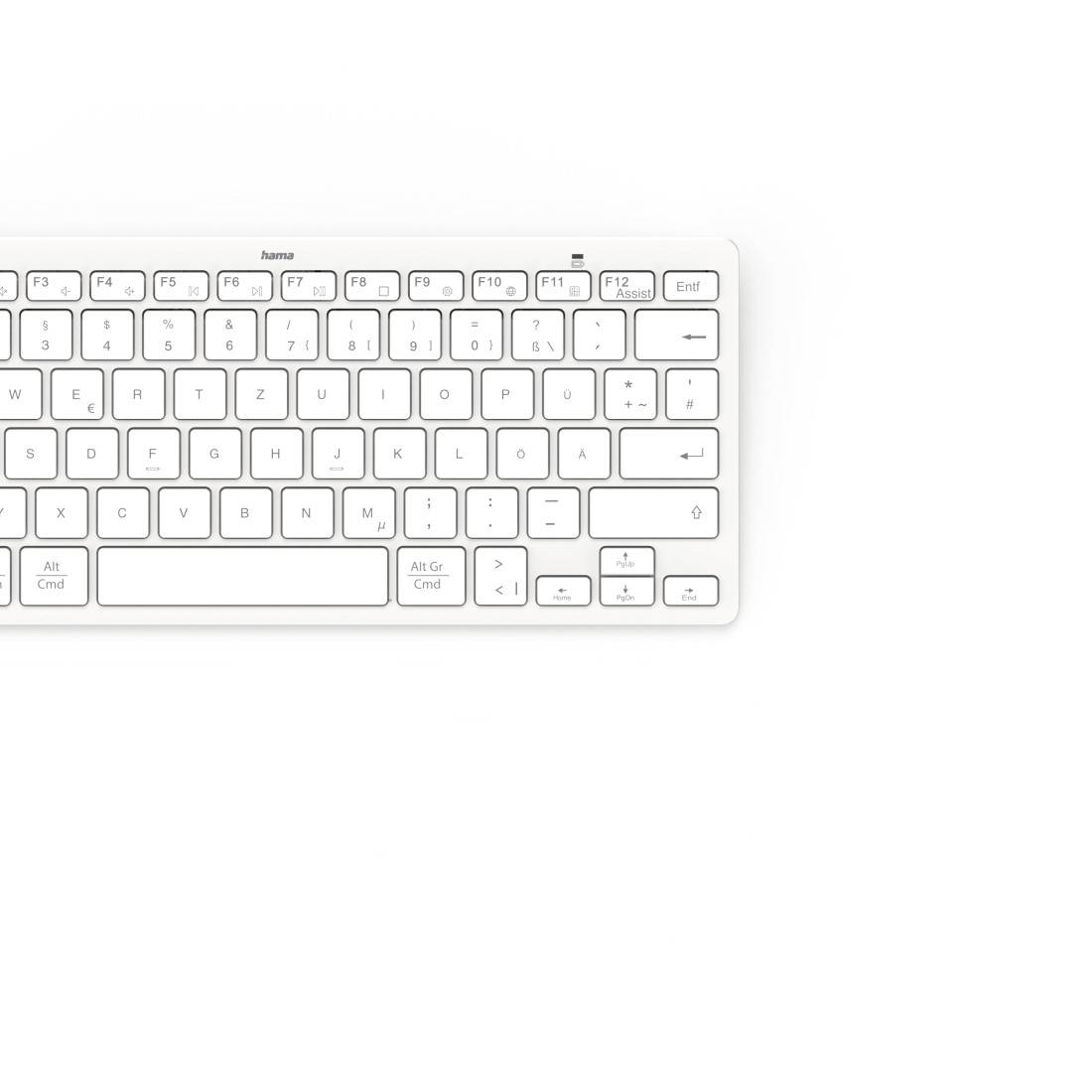 Kompakte weiße kabellose Tastatur mit französischem Tastaturlayout und Mac-Tasten, fotografiert auf weißem Hintergrund.