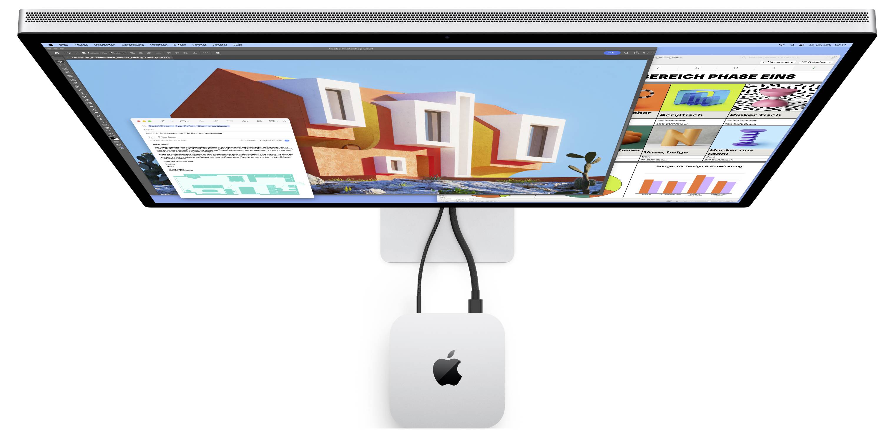 Wandmontiertes Apple-Display, das einen Design-Arbeitsbereich mit 3D-Gebäudemodellen, Diagrammen und Präsentationspanelen auf dem Bildschirm zeigt.