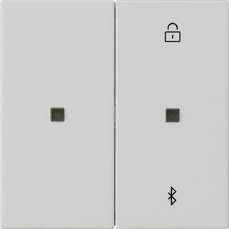 Zwei weiße Wandschalter-Paneele mit kleinen quadratischen Tasten; das rechte Paneel zeigt ein Schlosssymbol und ein Bluetooth-Symbol.