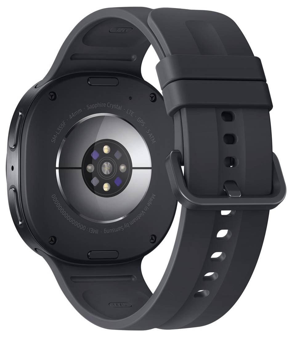 Rückseite einer schwarzen Smartwatch mit Silikonarmband, auf der Unterseite runde Sensoren und Ladekontakte sichtbar.