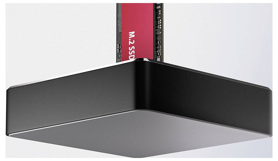 Schwarzes rechteckiges externes SSD-Gehäuse mit einer roten M.2-SSD, die teilweise von oben eingeführt ist