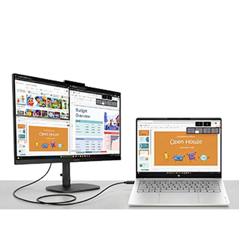 Desktop-Monitor und Laptop zeigen nebeneinander Präsentationen, mit einer Folie "Tag der offenen Tür" und einer tabellenkalkulationsähnlichen Seite "Budgetübersicht".