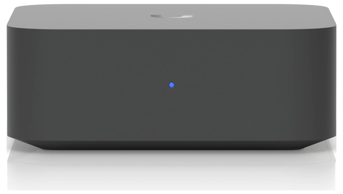 Schwarzer rechteckiger intelligenter Lautsprecher oder Hub mit einem kleinen blauen Statuslicht in der Mitte der Vorderseite, dargestellt auf weißem Hintergrund.