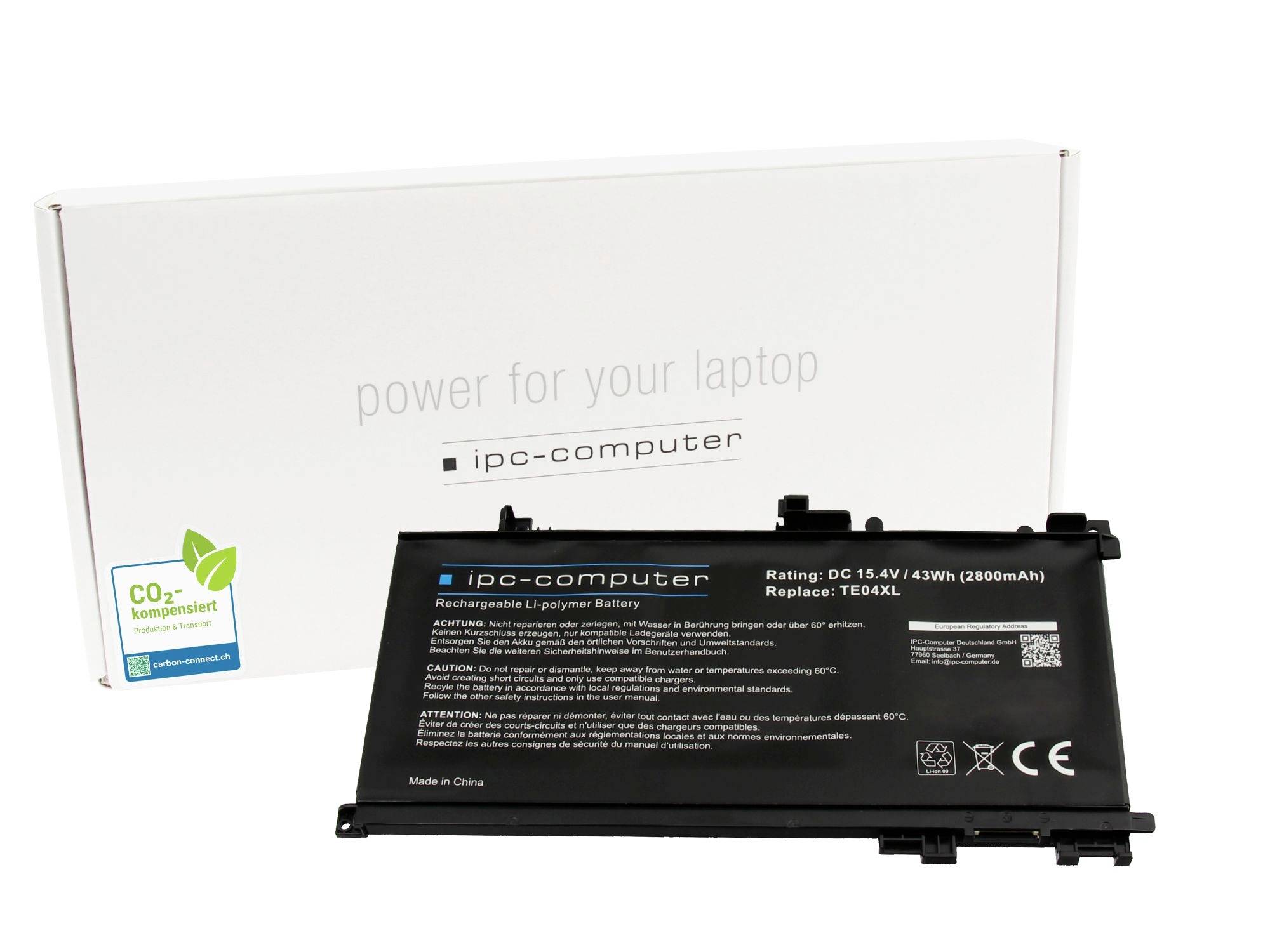 Laptop-Ersatzbatterie vor einer weißen "ipc-computer" Box mit der Beschriftung "Strom für Ihren Laptop" und "CO2 kompensiert" Logo.