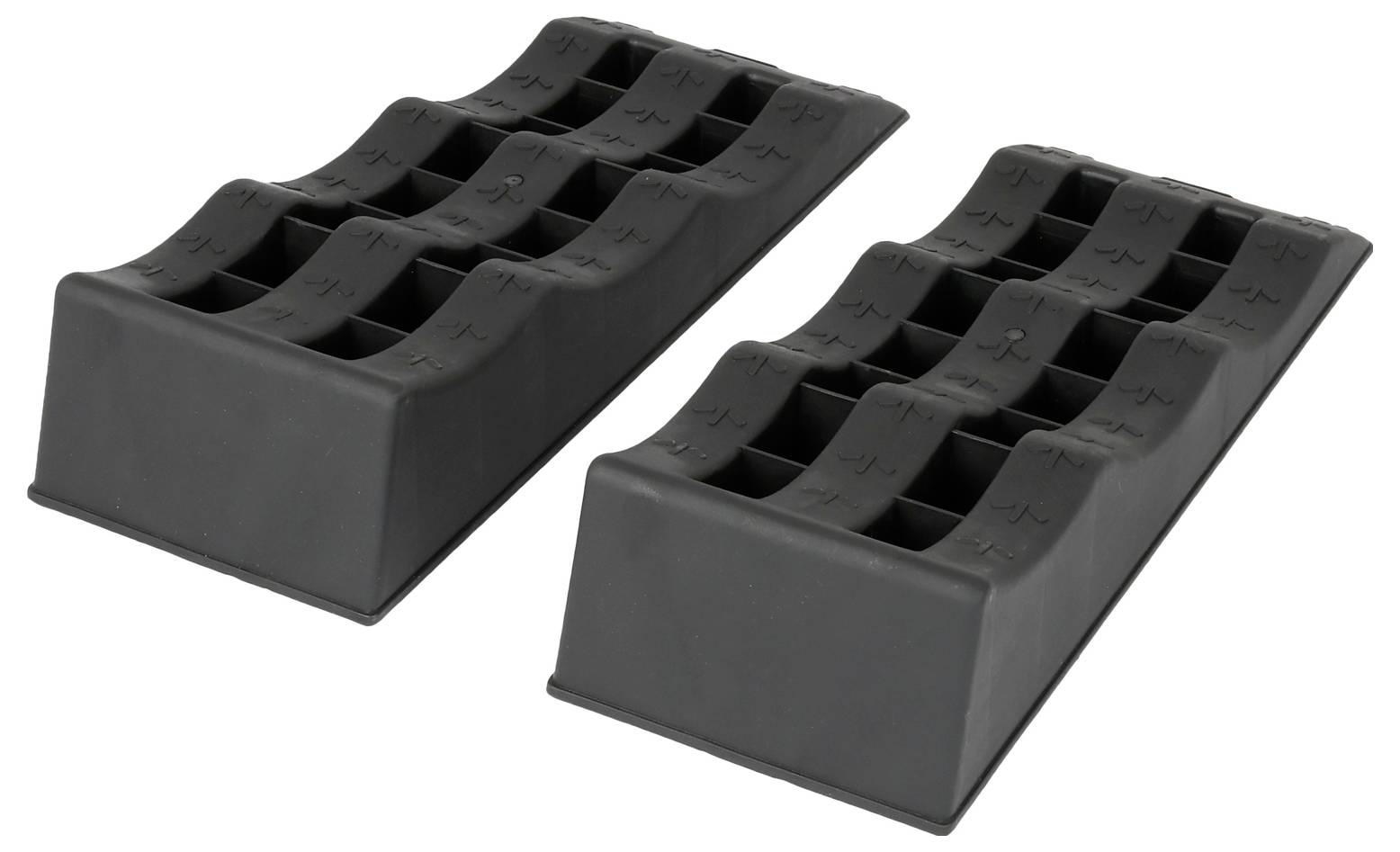 Zwei schwarze Gummiradkeile mit strukturierten Oberflächen, nebeneinander auf weißem Hintergrund dargestellt.