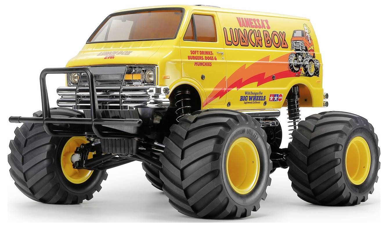Gelber Monstertruck-Van mit der Aufschrift „Lunch Box", übergroßen Reifen und schwarzer Frontschutzvorrichtung, gezeigt vor weißem Hintergrund.