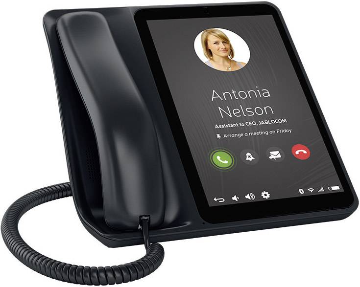 Schwarzes Tischtelefon mit Display. Zeigt Anruf von 'Antonia Nelson, Assistentin des CEO, JabloCom' an. Optionen: Annehmen, Ablehnen.