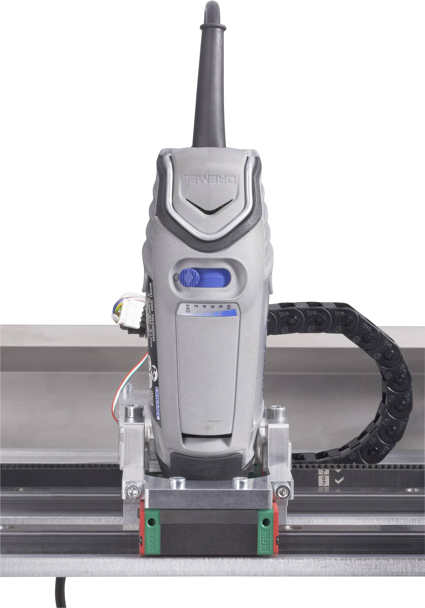 Eine elektrische Maschine zur präzisen Bearbeitung von Oberflächen, auf einer Führungsschiene montiert.