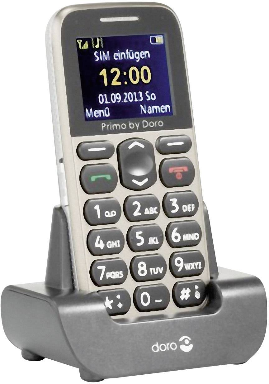 Ein einfaches Mobiltelefon in einer Ladeschale mit großen Tasten. Der Bildschirm zeigt '12:00, 01.09.2013 So, Menü, Namen'.
