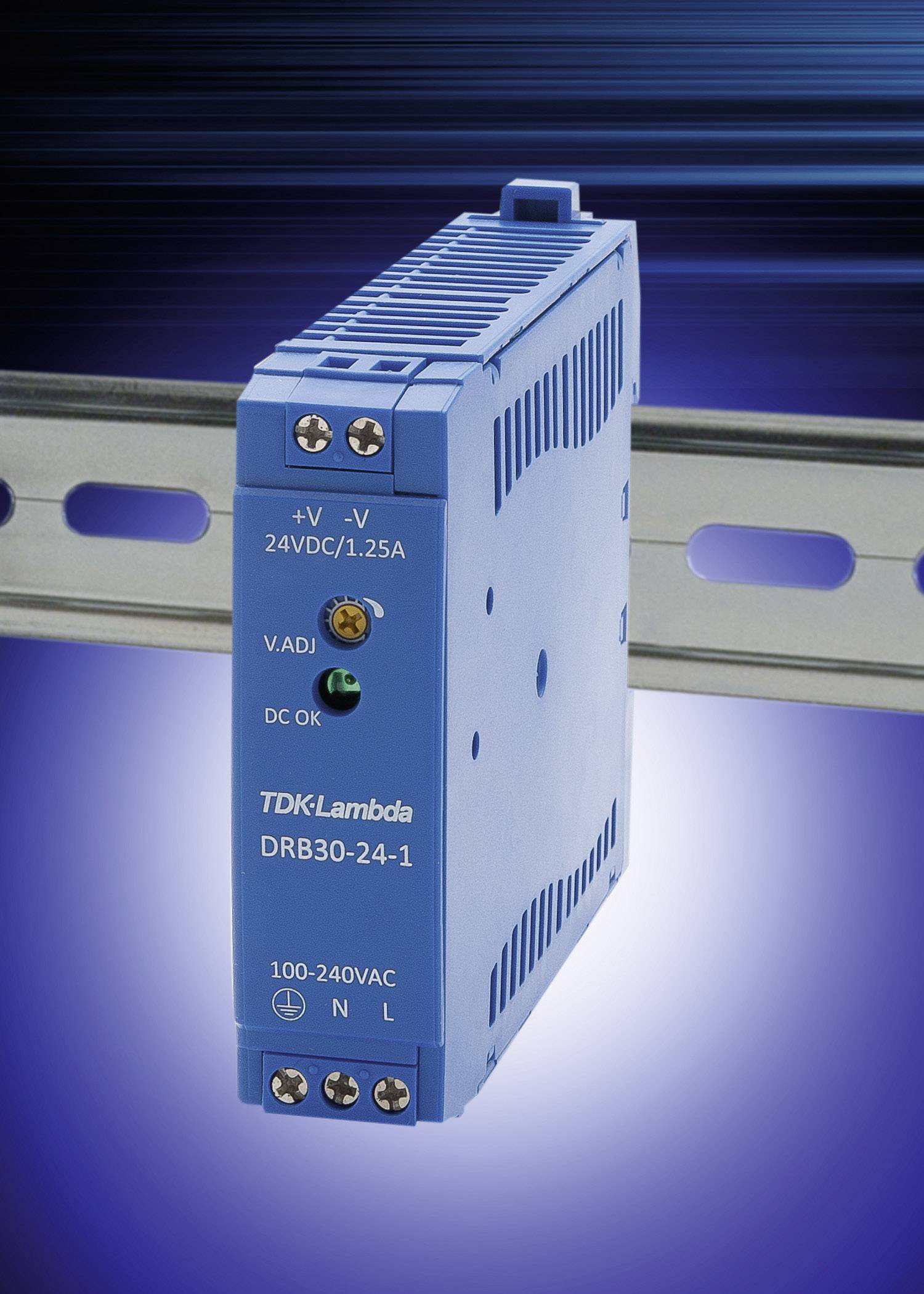 Ein blaues, rechteckiges Netzteil (TDK Lambda DRB30-24-1) ist auf einer Schiene montiert. Aufschrift zeigt '24VDC/1.25A'.