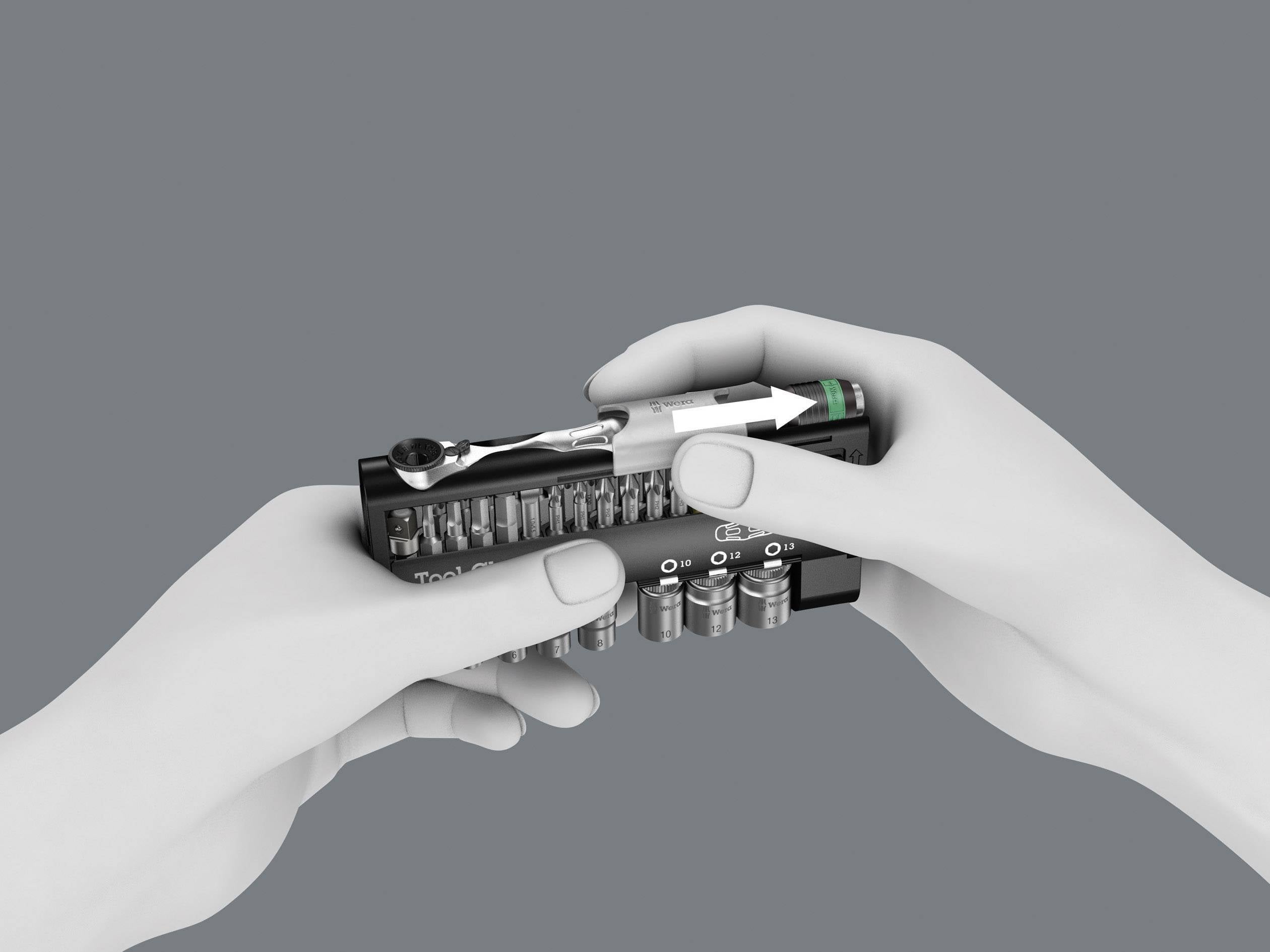 Zwei Hände halten einen Bit-Satz mit verschiedenen Schraubendrehereinsätzen und einem Schraubendreher auf grauem Hintergrund.