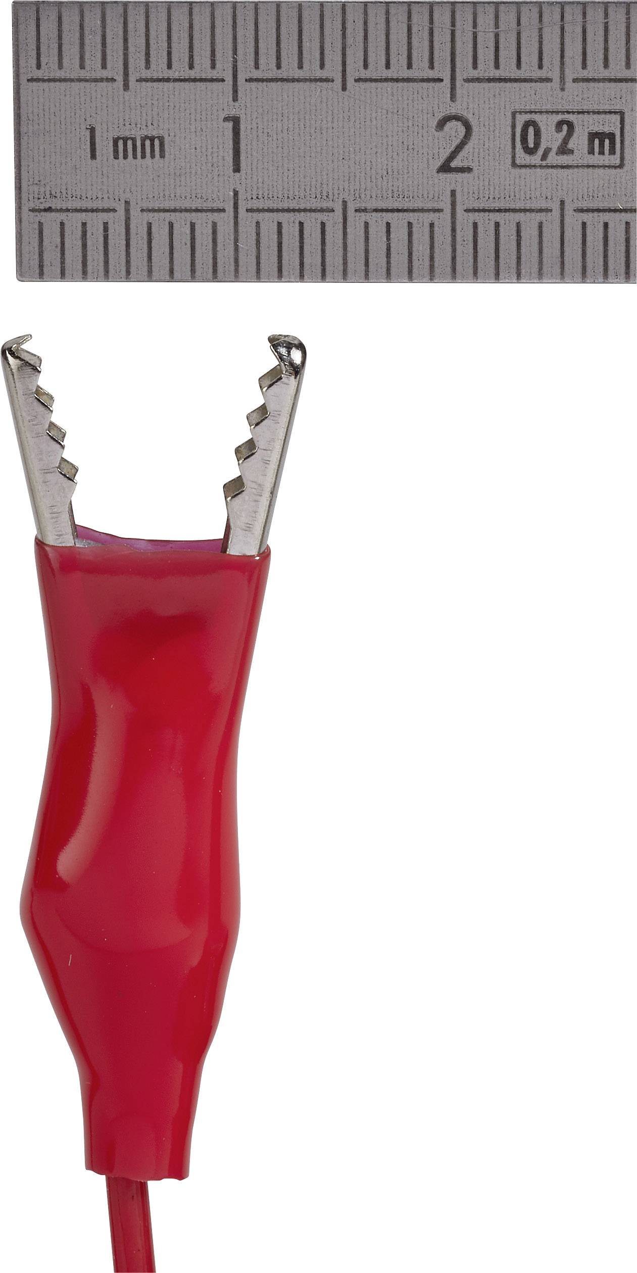 Rotes Krokodilkabel vor einem Zollstock mit Millimeter-Markierungen.