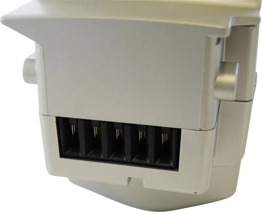 Silberner Adapterstecker mit fünf schwarzen Anschlussöffnungen, seitliche Befestigungshaken sichtbar.