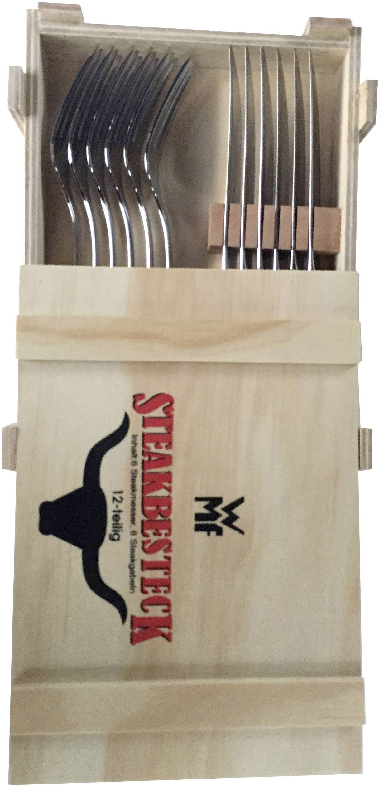 Ein Holzkasten mit Aufschrift 'Steakbesteck' zeigt sechs silberne Steakmesser ordentlich nebeneinander platziert.