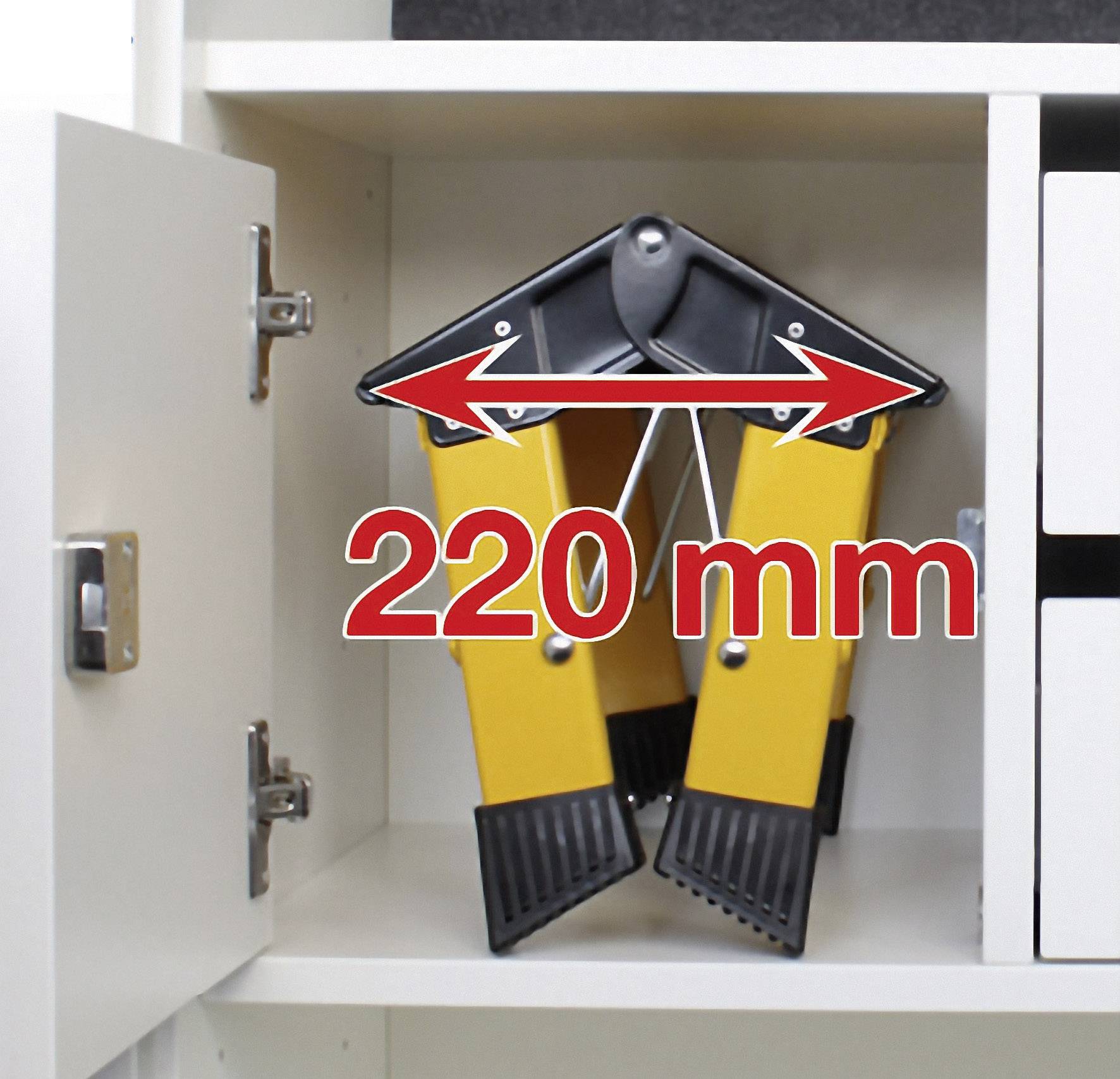 Ein Regalstopper mit gelben Beinen und schwarzen Enden ist 220 mm breit. Er steht geöffnet in einem Schrankregal.