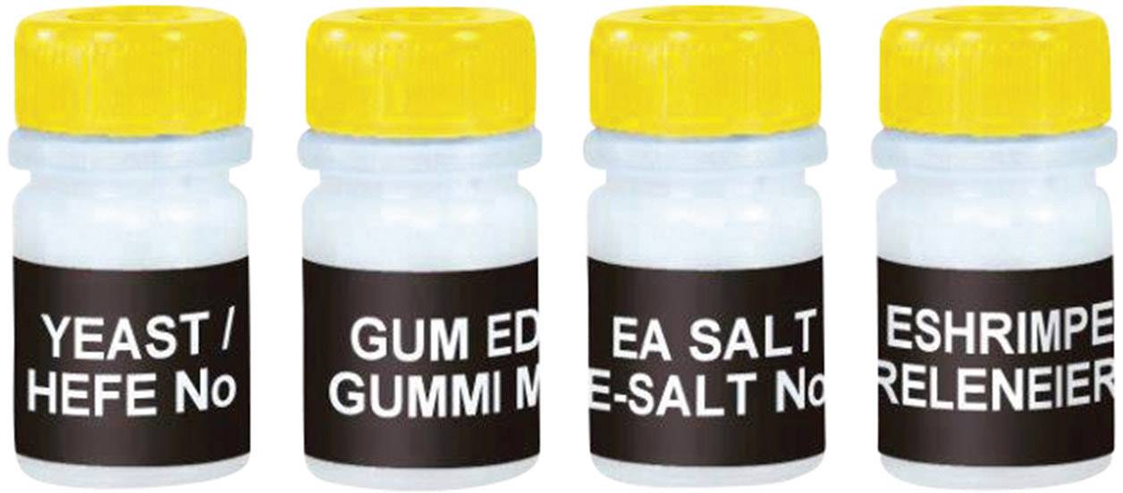 Vier kleine Fläschchen mit gelben Deckeln, jeweils beschriftet mit 'YEAST / HEFE No', 'GUM ED / GUMMI M', 'SEA SALT / ME-SALT No', 'BRINE SHRIMP / SALZKREBSRELEINEIER'.