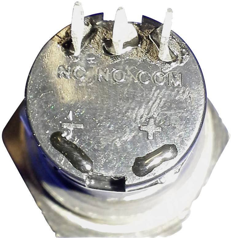 Nahaufnahme eines elektronischen Bauteils mit drei Anschlüssen und Markierungen '+', '-', 'NC', 'NO' und 'COM' auf der Oberseite.